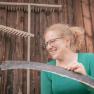 Julia grinding the scythe, © Einkehrhof Poggau Julia grinding the scythe, © Einkehrhof Poggau