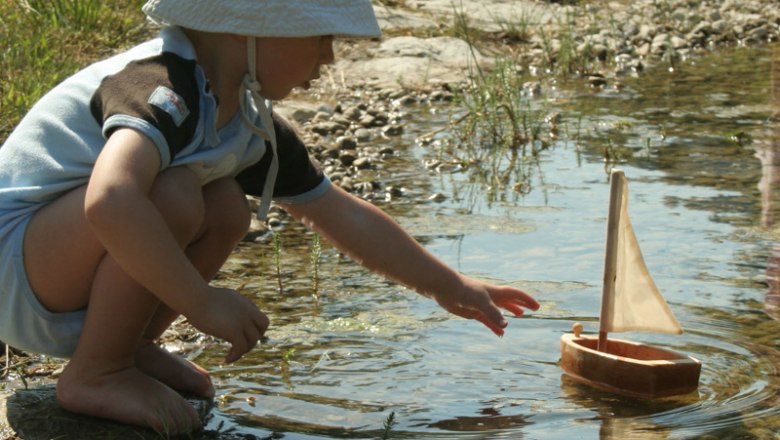 Child with wooden ship, © Familie Erber Child with wooden ship, © Familie Erber