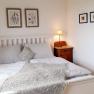 Comfortable double bed in the bedroom, © U.E.