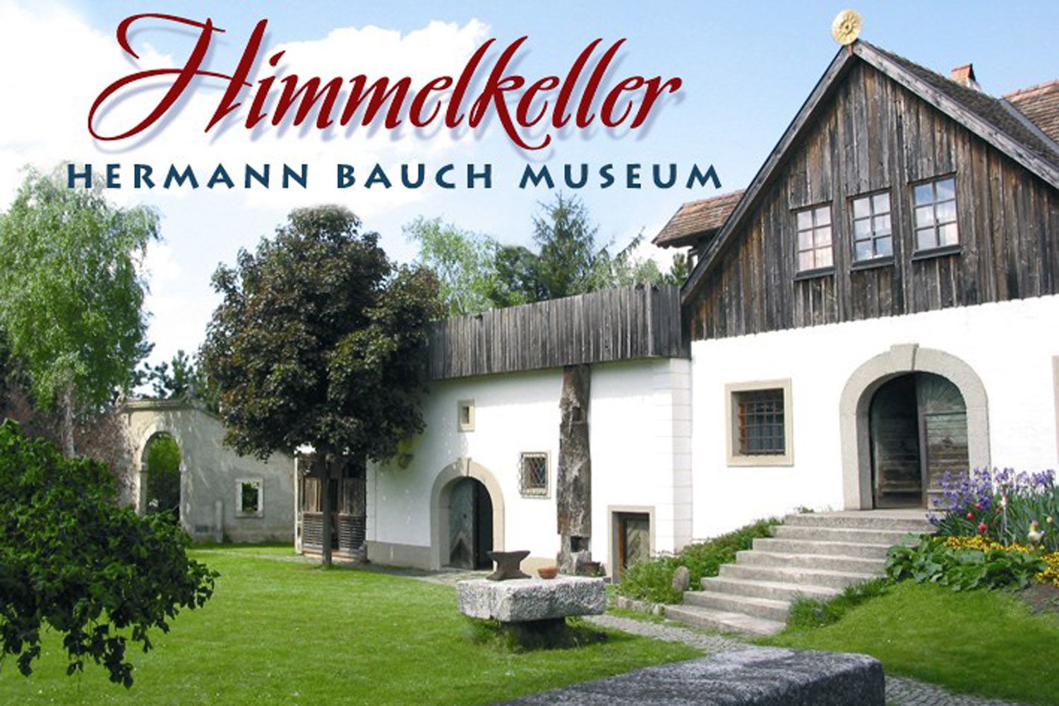 Vnější pohled na Muzeum Hermanna Baucha se zahradou a budovami.