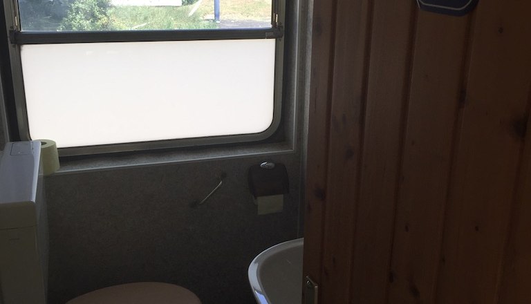 View into the small WC of the 100-year-old baggage car, &copy; M. Schorn